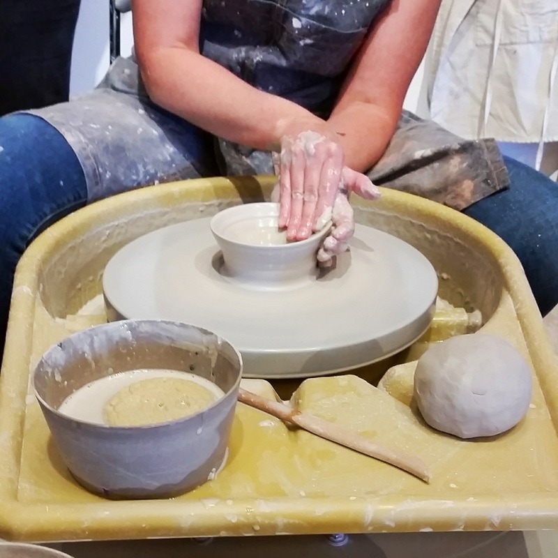 Shaping Clay on Pottery Wheel
