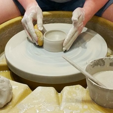 Smoothing Clay on Pottery Wheel
